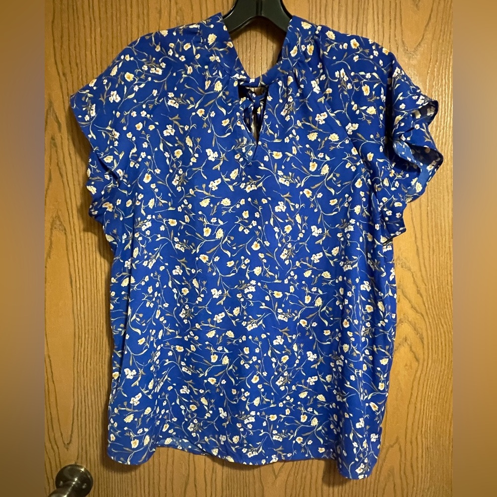 EUC Pleione Blouse From Anthropologie in a Blue Floral Print and Flutter Sleeves
